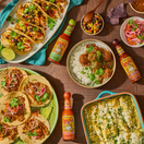 hot sauce on table with mexican food