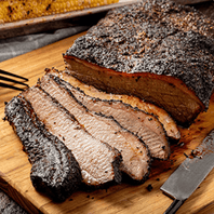 steak on a cutting board with a knife