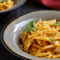 noodle dish in bowl with cilantro