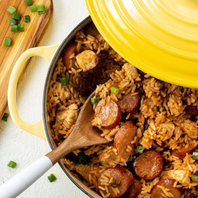 rice and sausage dish in yellow pot