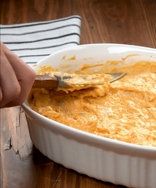 Putting mixed ingredients in a baking dish